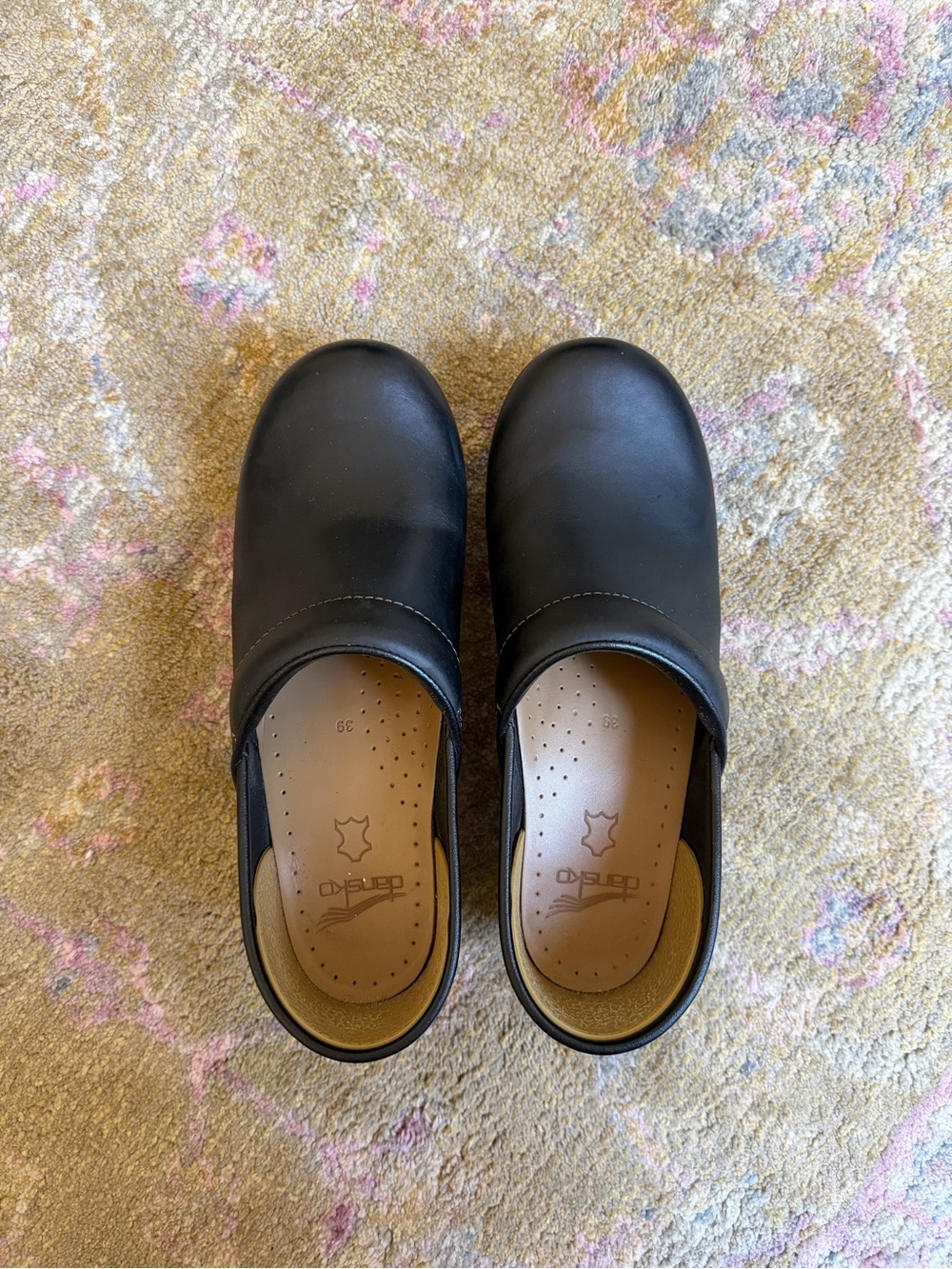 Dansko black leather clogs